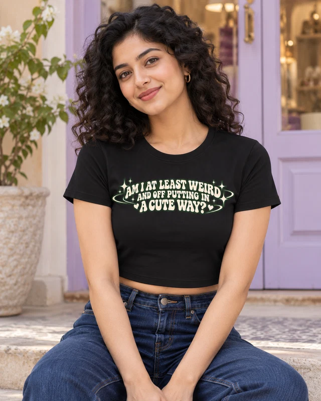 Weird in a Cute Way Graphic Crop Top in Black — model view 1